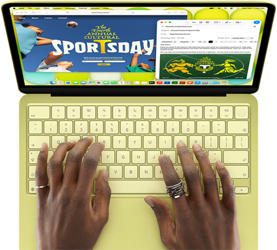 MacBook Neo, Farbe Zitrus, eine Person tippt auf der Tastatur und verfasst eine E-Mail Einladung zur Eröffnung eines Sportevents, die Website für das Event wird daneben angezeigt
